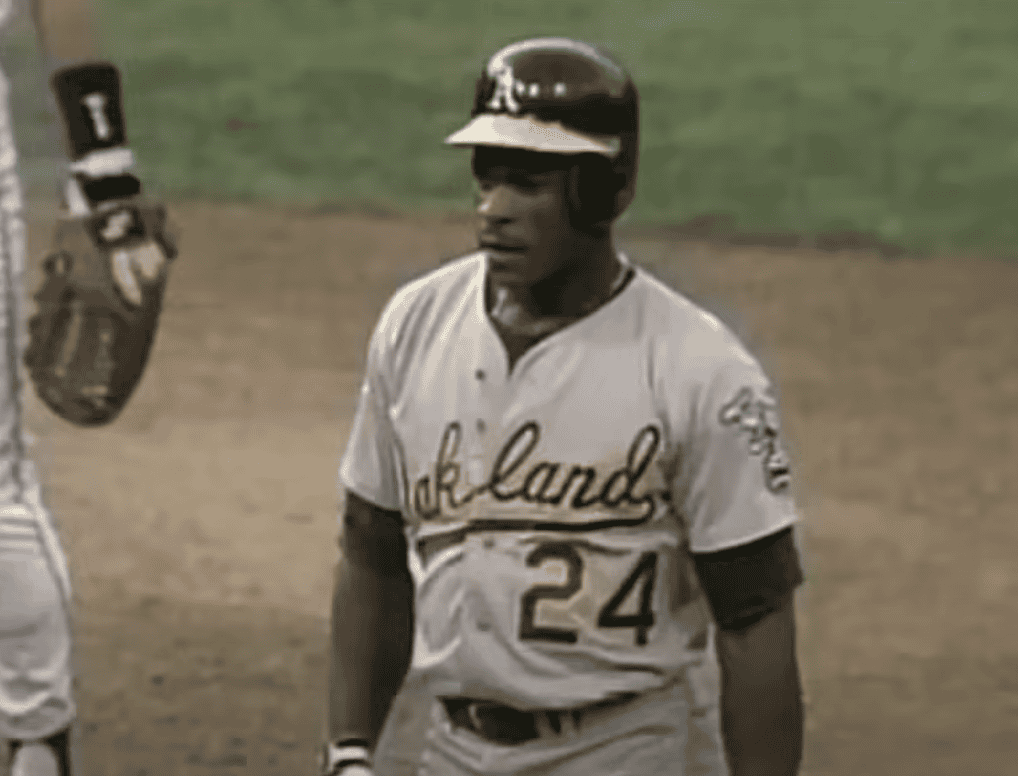 Rickey Henderson in action, showcasing his speed and skill as a top player.